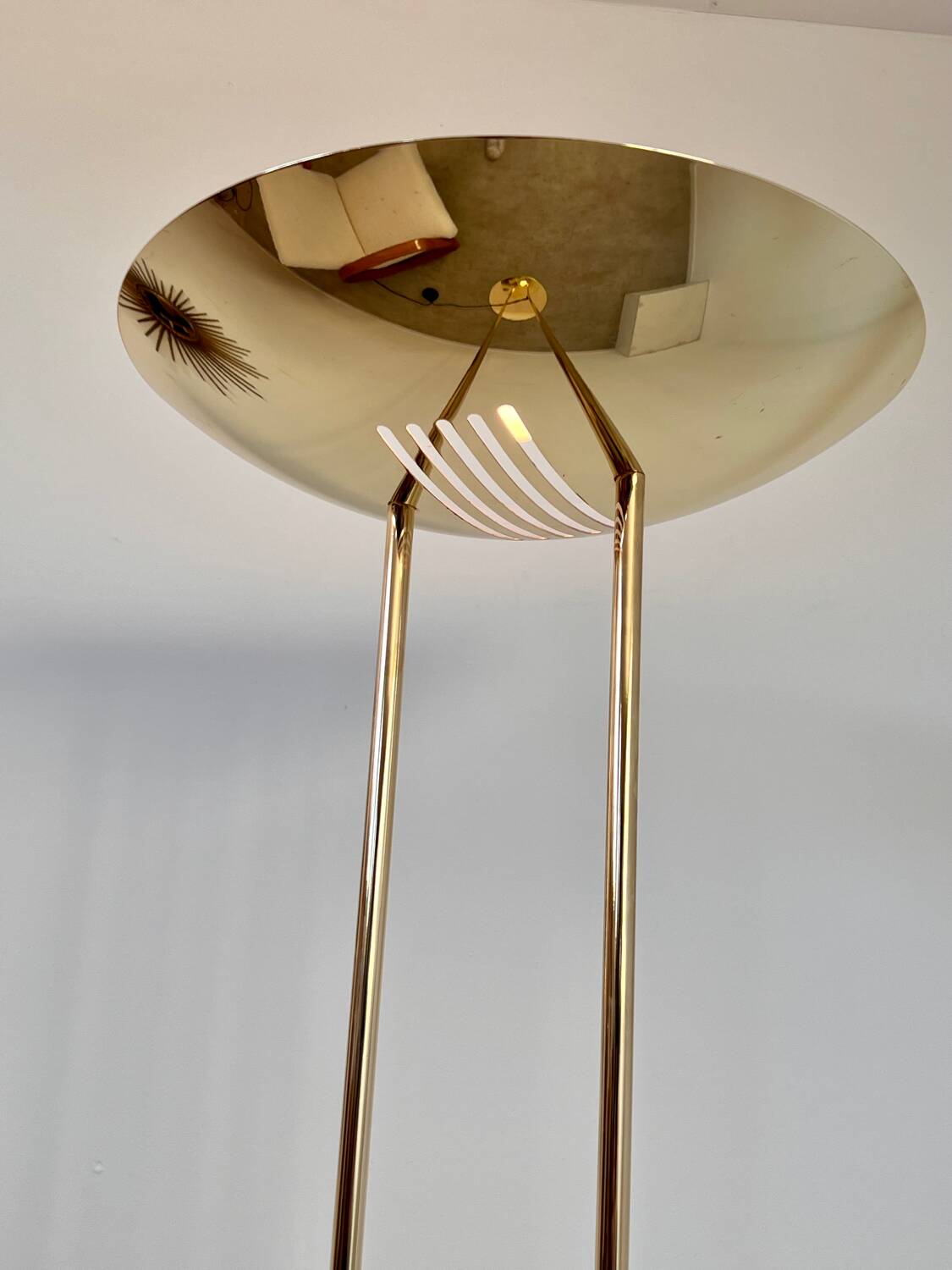 Old golden brass floor lamp with Italian design bulb from the 70s vintage