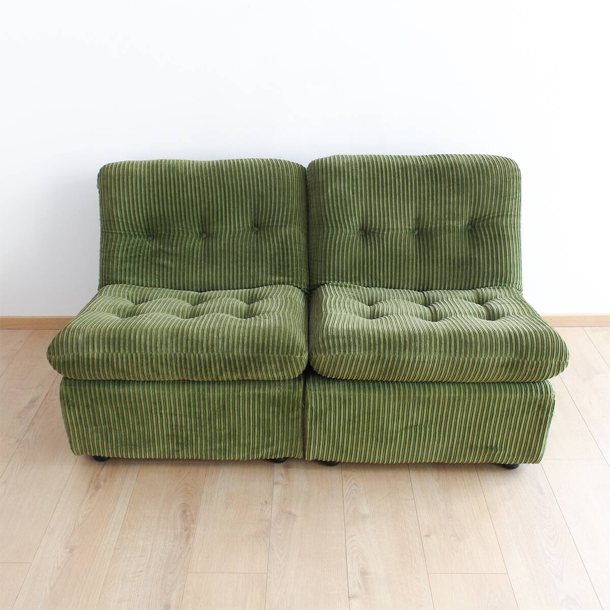 Modular vintage sofa with green cord upholstery