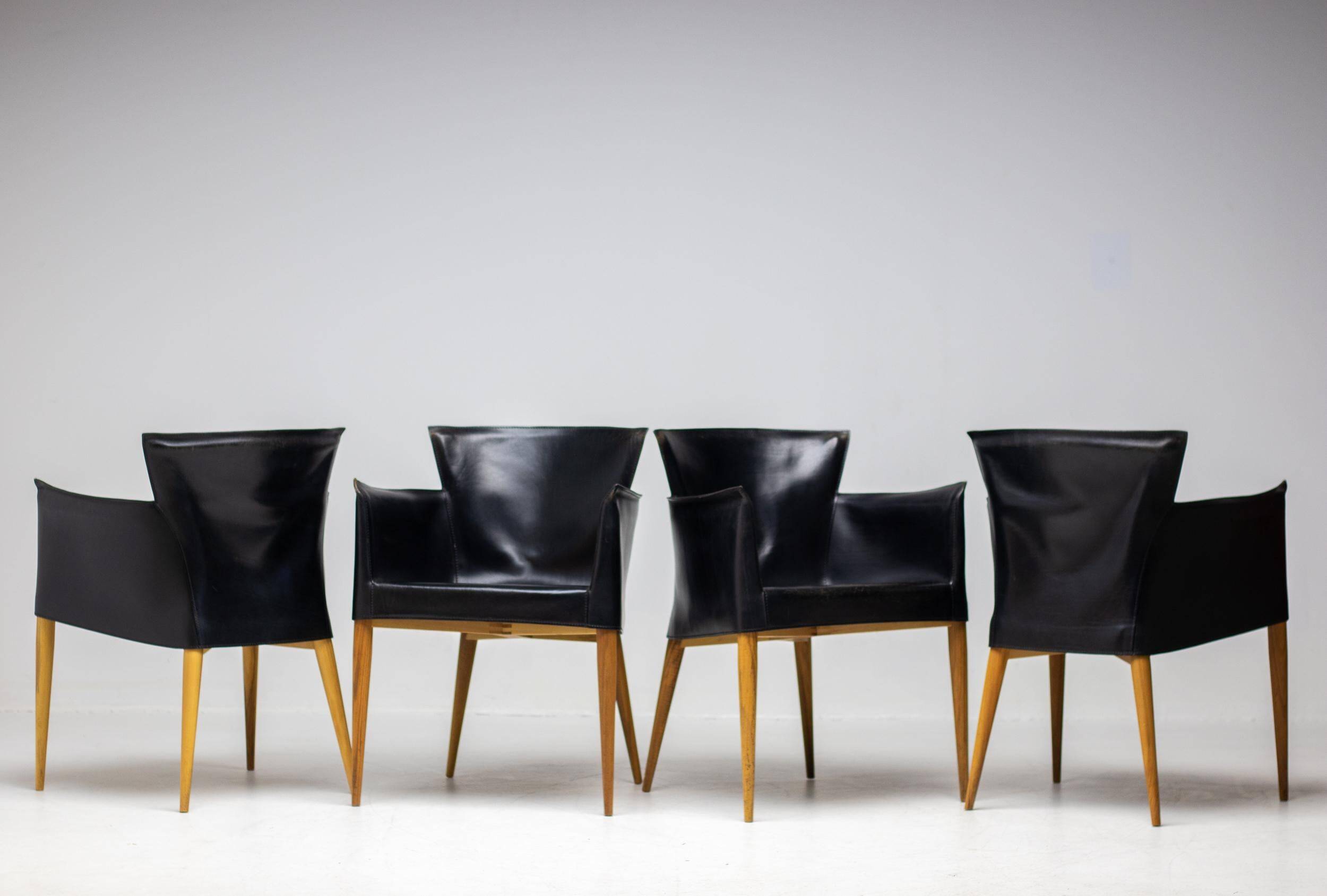 Set of four Vela leather armchairs by Carlo Bartoli - Italian modern elegance.