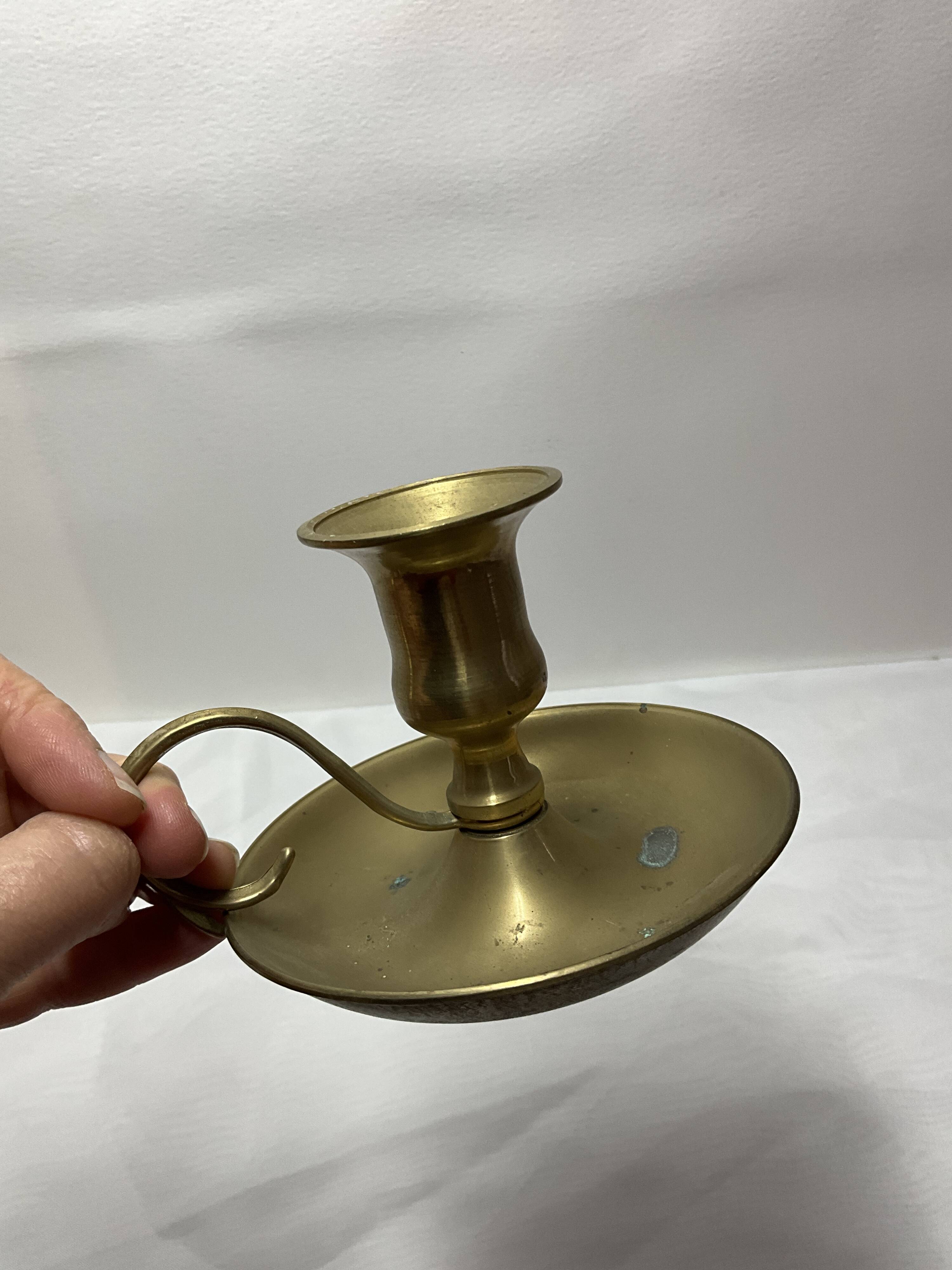 Brass hand candle holder