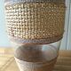 Cane glass-decorated vase and natural fibers