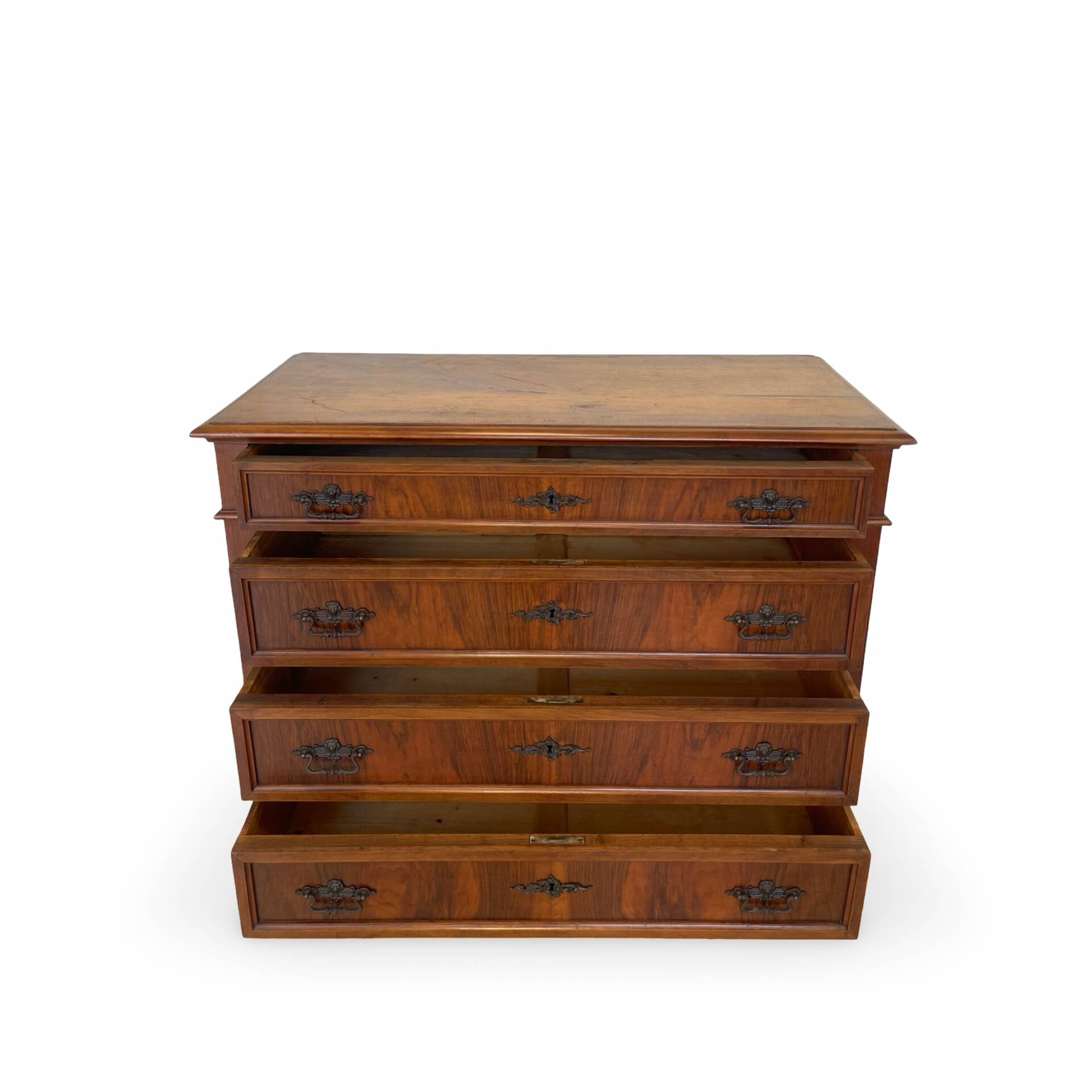 Antique walnut commode with bronze handles in the shape of a lion's mask,