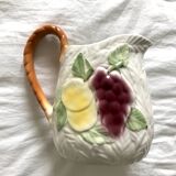 Antique barbotine pitcher with fruit decoration