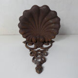 Old cast iron planter shell-shaped plant support