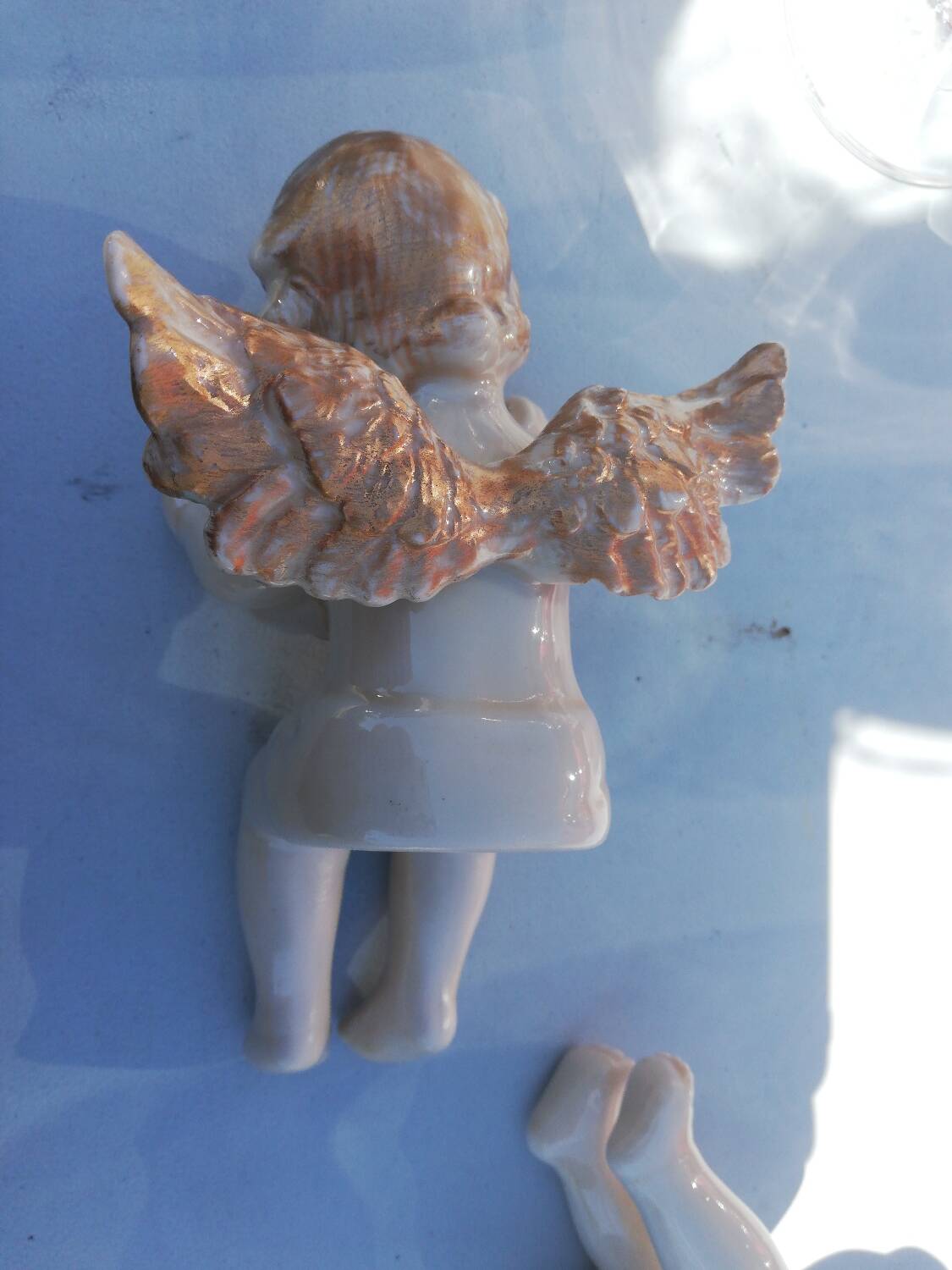 Pair of sitting angel statuettes