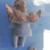 Pair of sitting angel statuettes