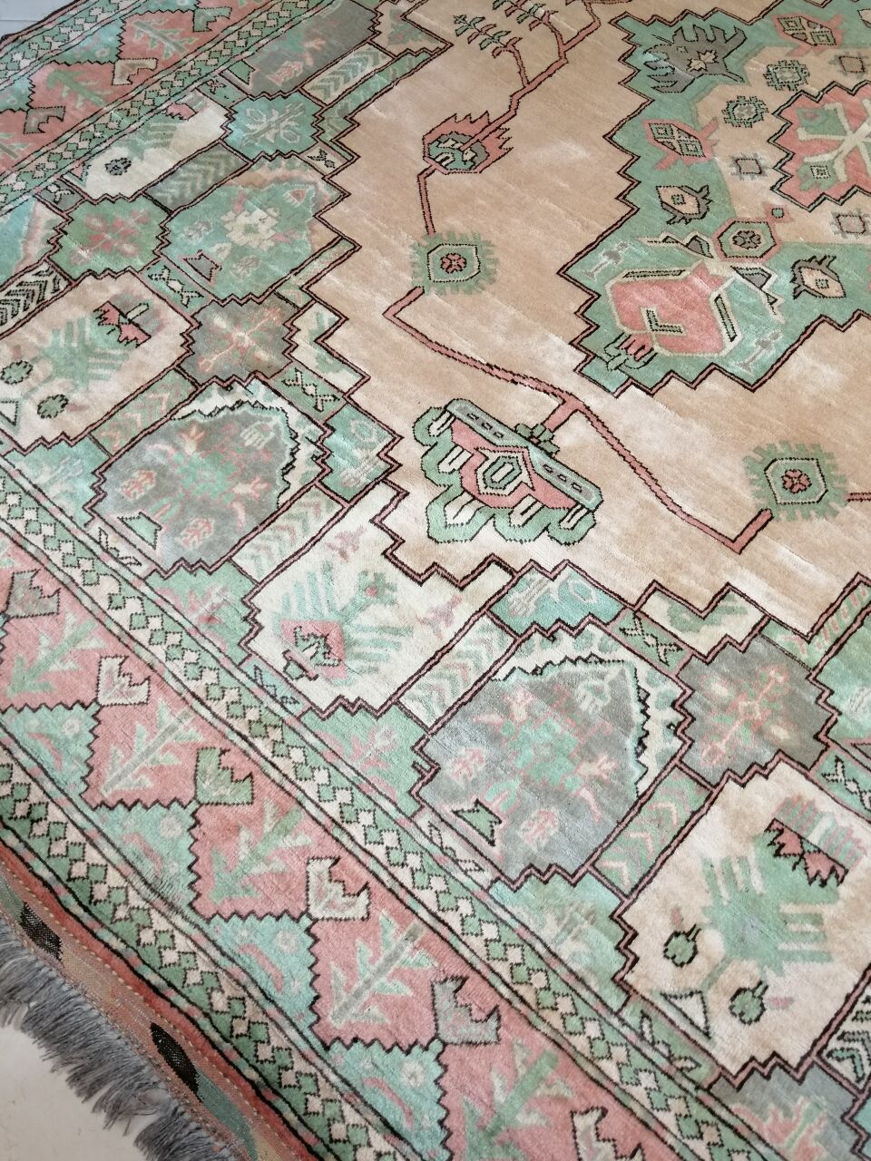 Afghan rug in pastel colors