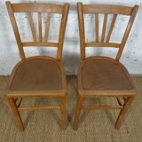 oak tray table with cast iron legs and pair of bistro chairs