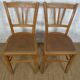 oak tray table with cast iron legs and pair of bistro chairs