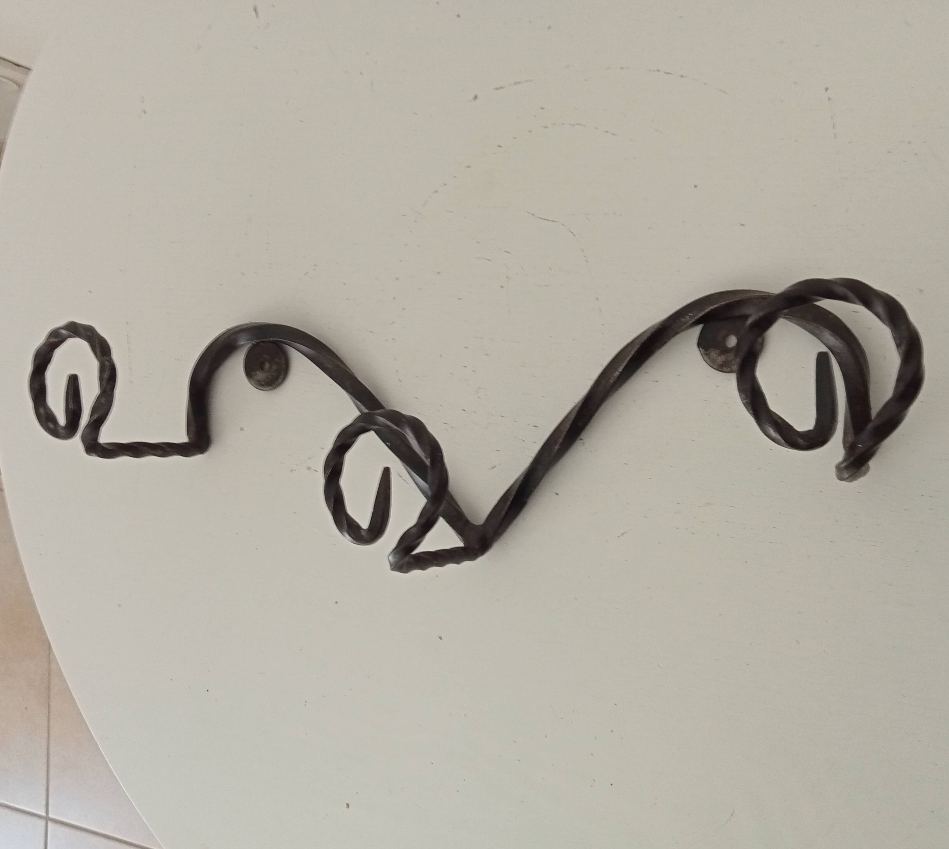 Vintage wrought iron wall coat rack