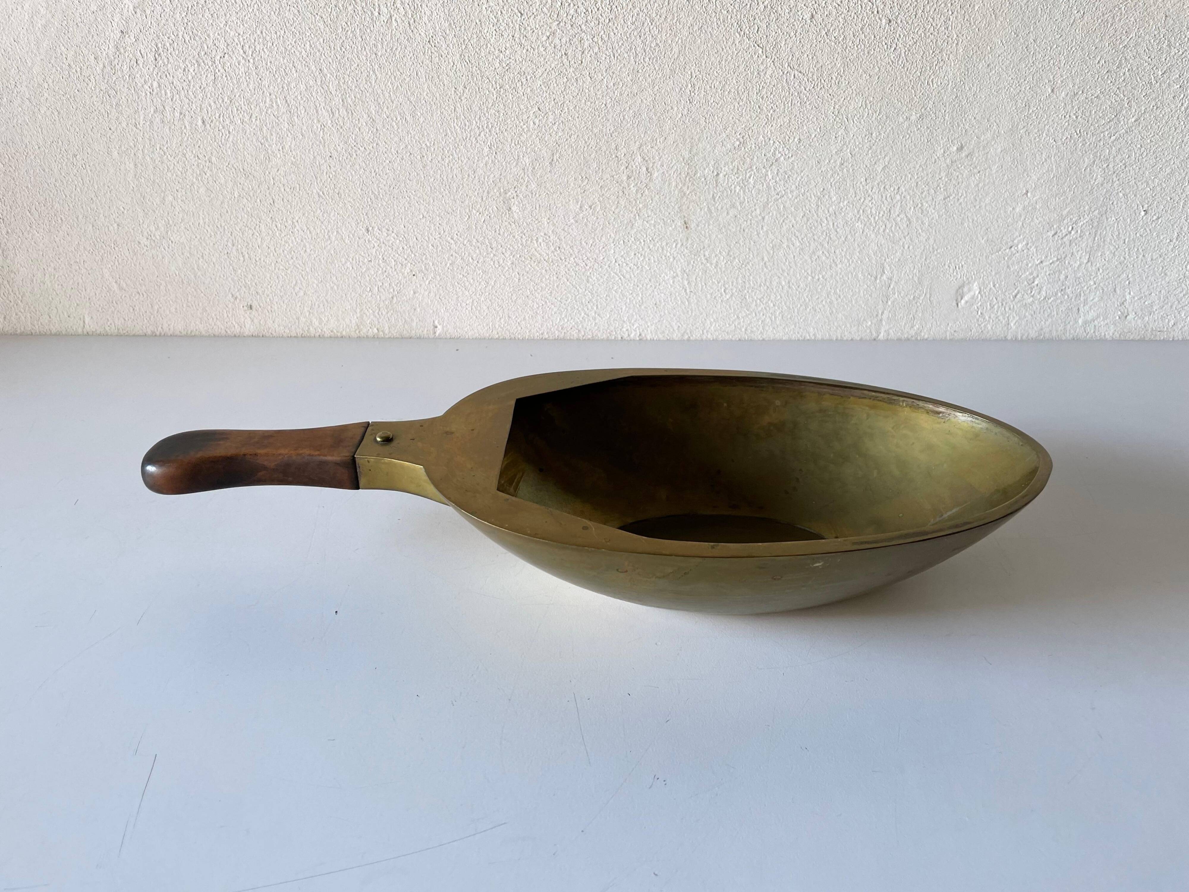 Decorative brass bowl with wooden handle, 1970s, Turin, Italy.