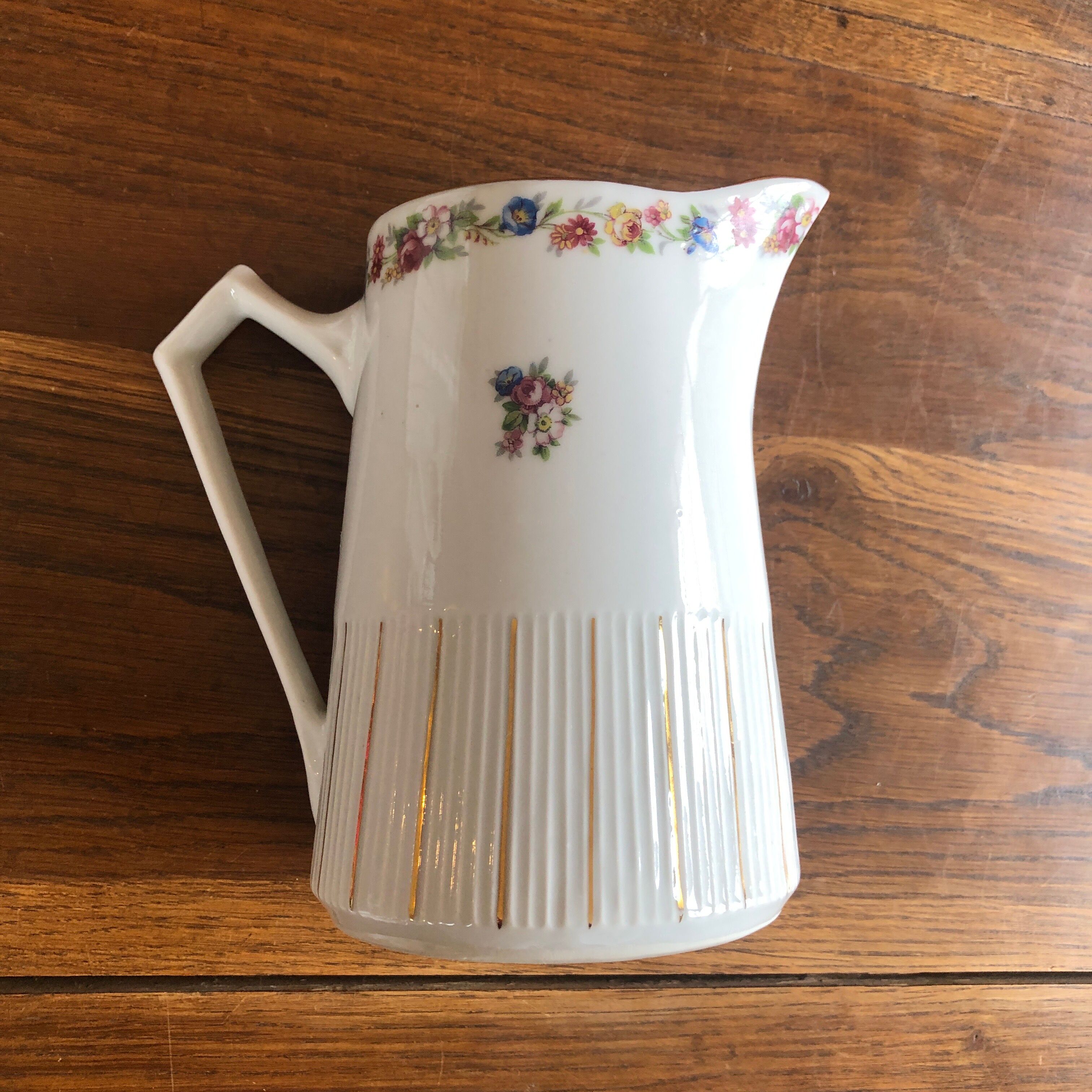 Porcelain pitcher with flowers