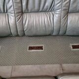 Three-seater sofa in green leather with a solid wood frame