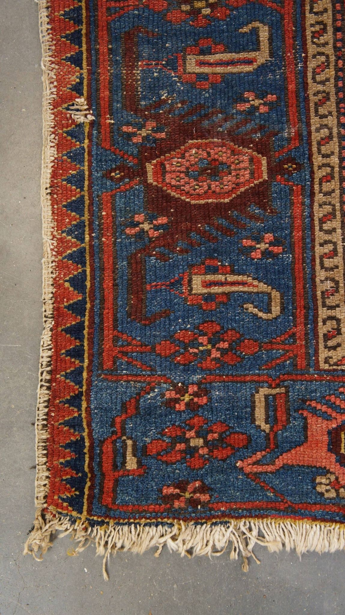 Antique hand-knotted oriental rug with predominantly red, purple, and blue colors 182x136cm