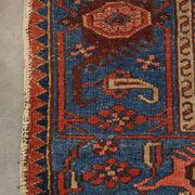 Antique hand-knotted oriental rug with predominantly red, purple, and blue colors 182x136cm
