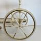 Italian oval rolling table in brass and lacquered wood.