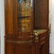 Empire style half-moon shaped mahogany bookcase with putti