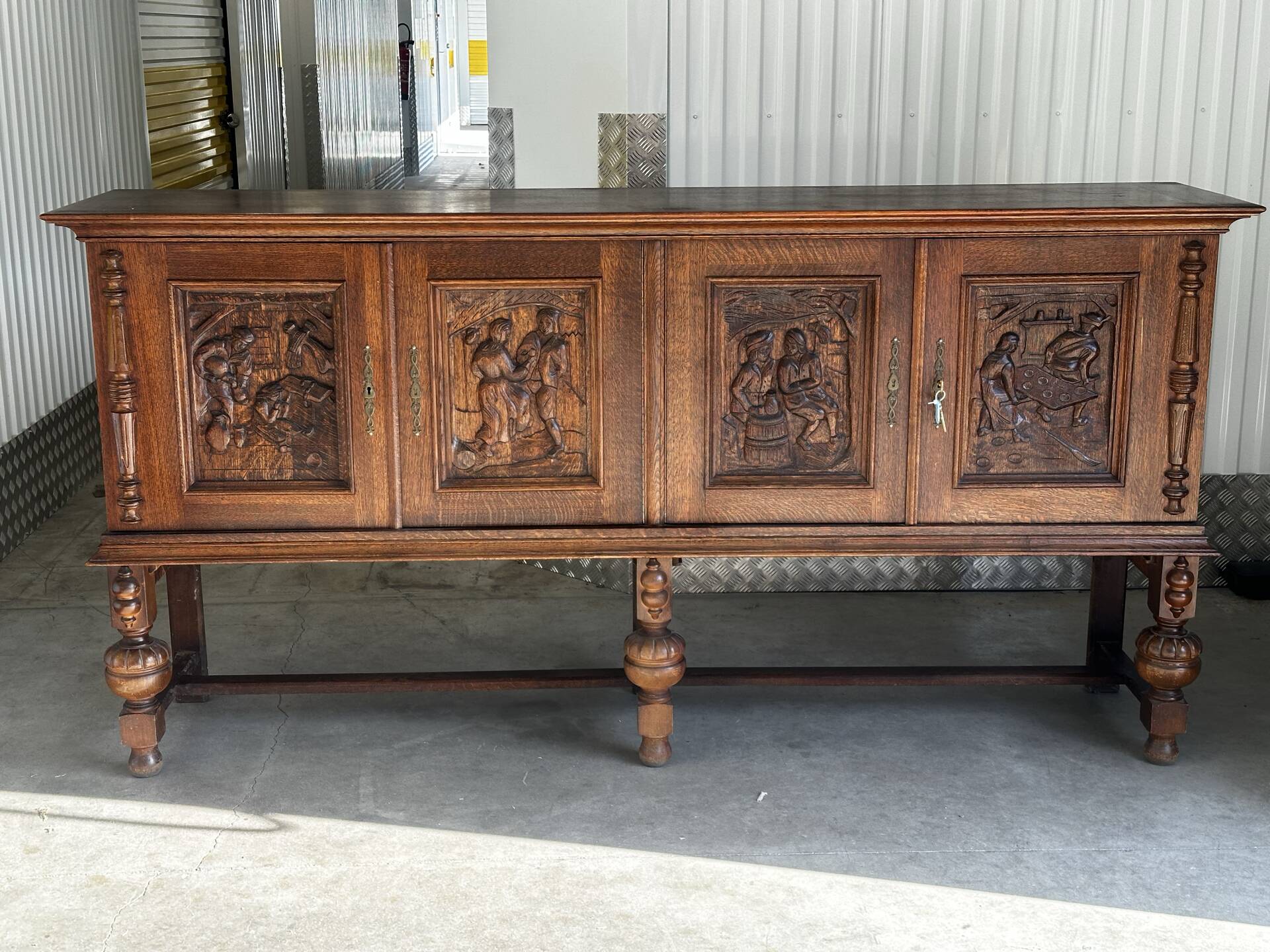 Large carved oak buffet in neo-Renaissance style, mid-20th century.