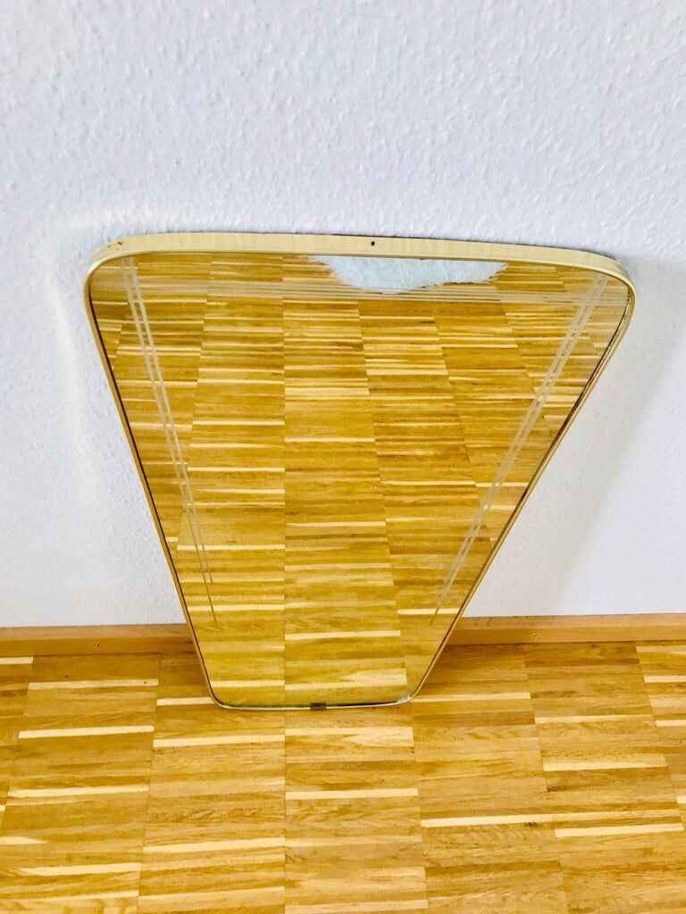 Italian asymmetrical wall mirror framed in brass 1960s Italy