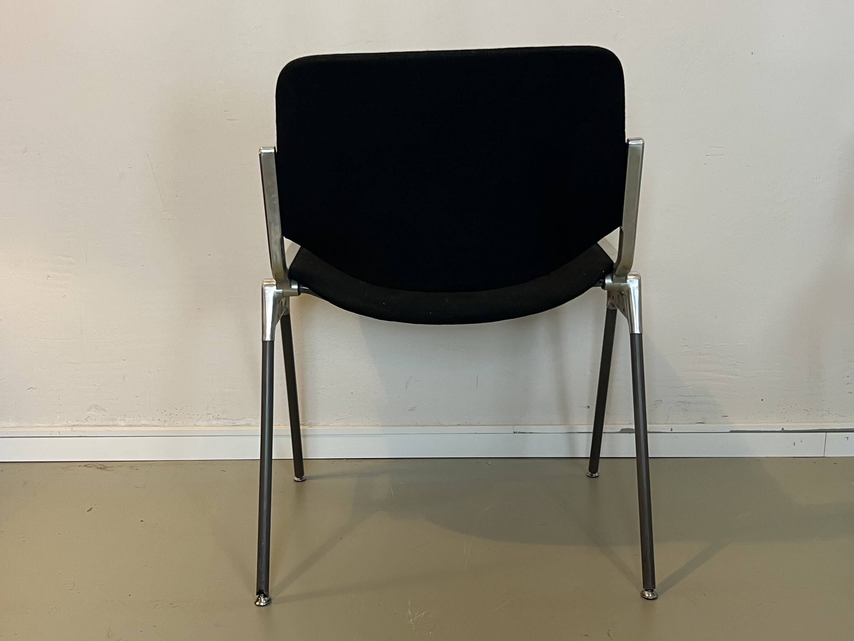 Black DSC chairs by Giancarlo Piretti for Castelli from the 60s/70s.