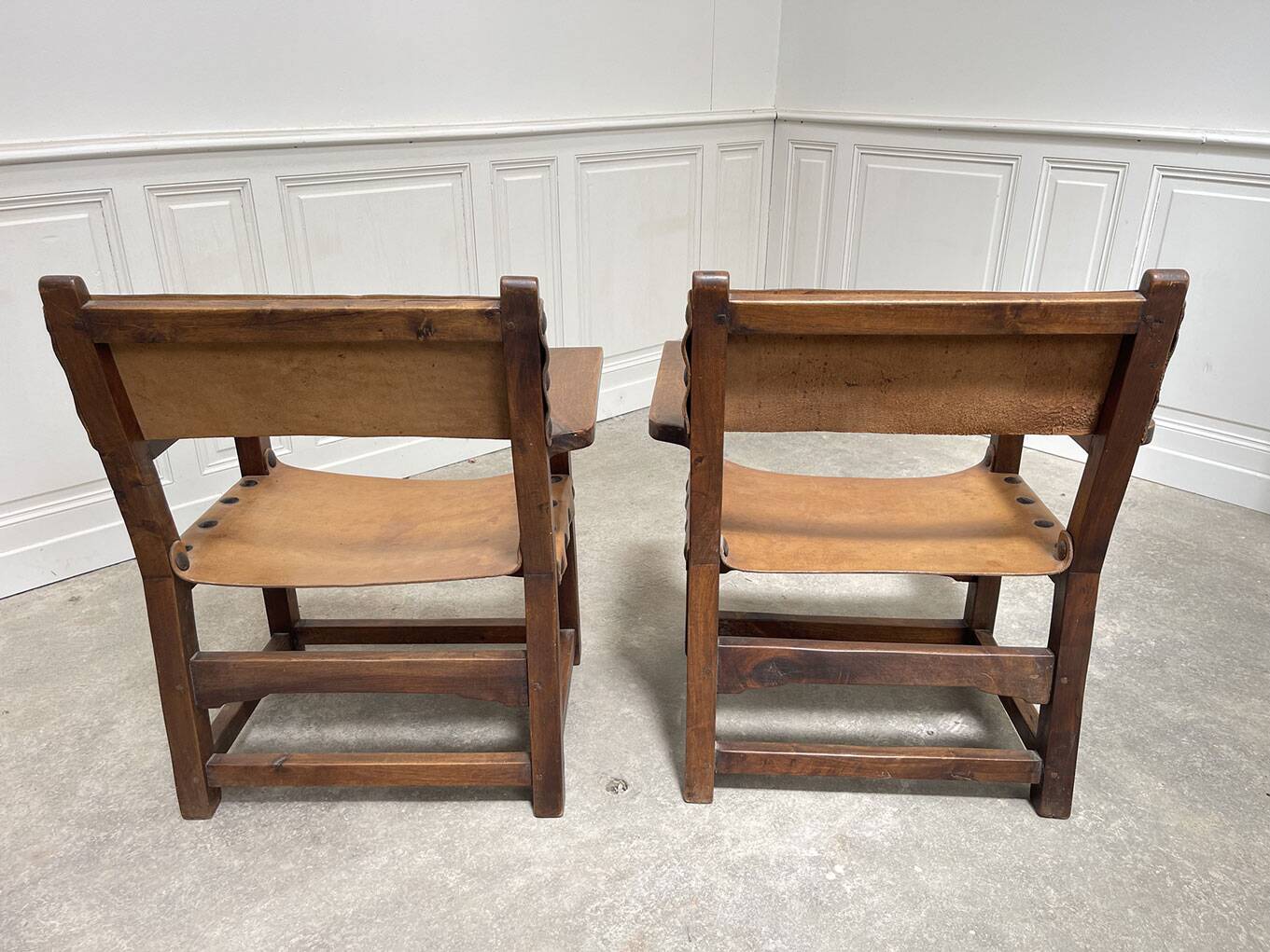 Pair of leather and walnut armchairs from the 1950s