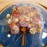 Oval frame bouquet of dried flowers with curved glass