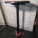 Bistro standing table with marble top and cast iron base.