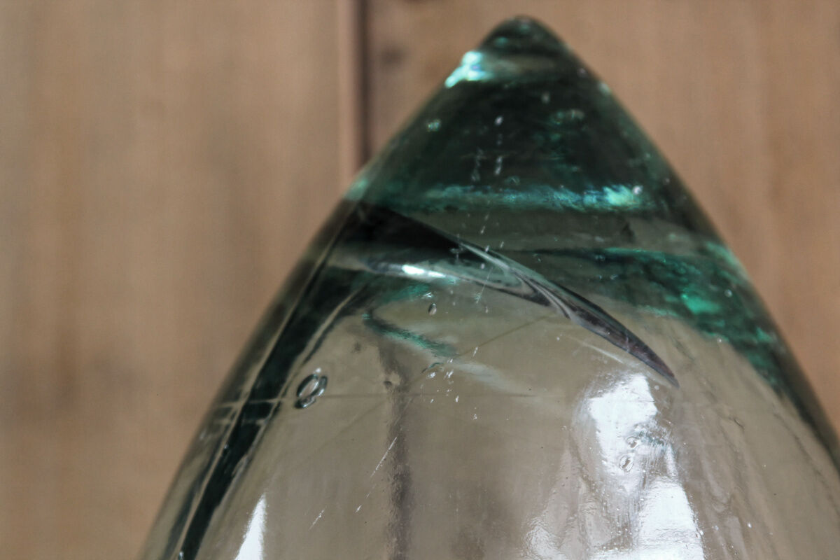 Old blown glass bottle, amphora-shaped