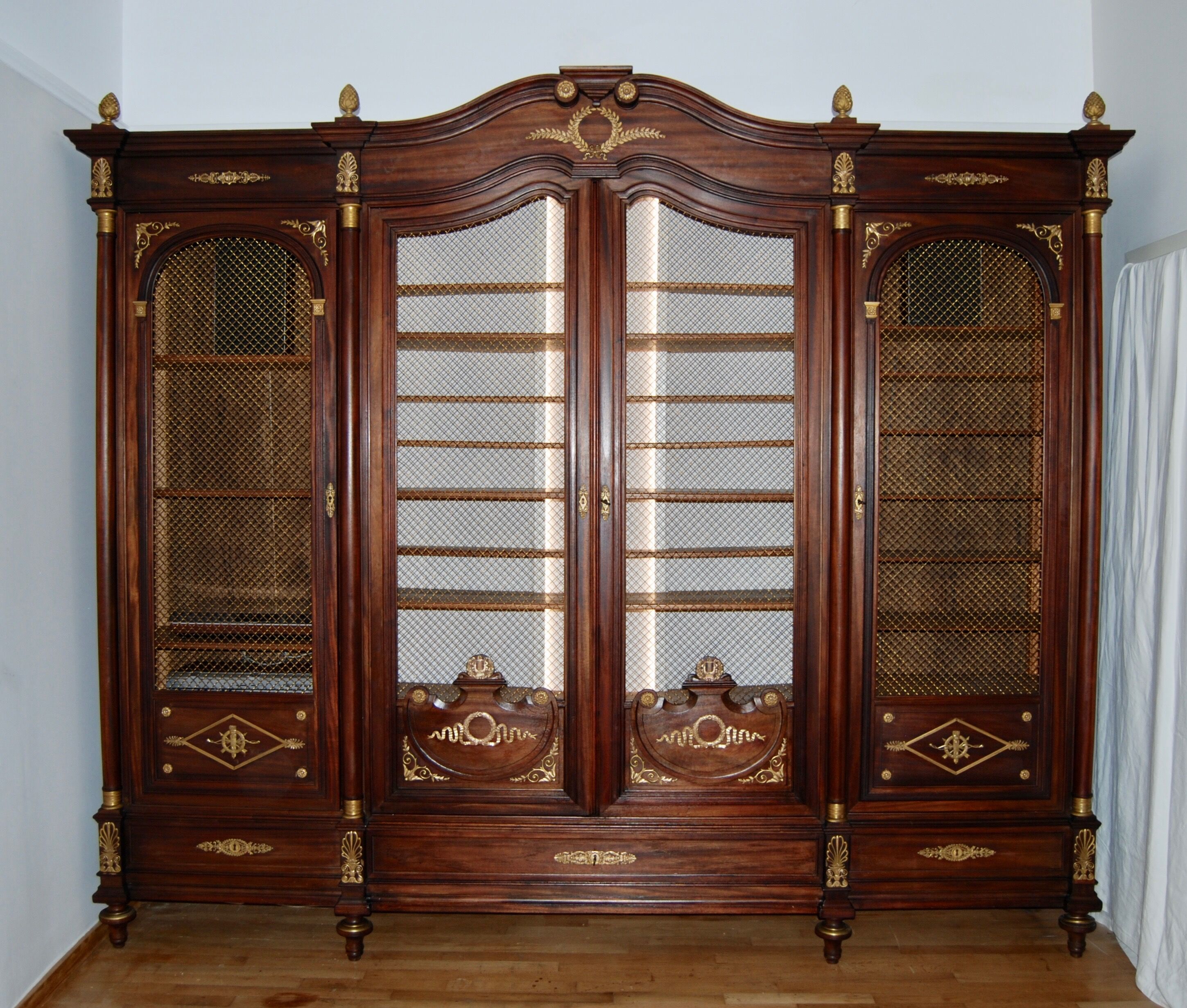 Large Empire library in solid mahogany, late nineteenth century