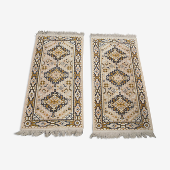 duo of small cotton rugs, oriental geometric decoration, with fringes
