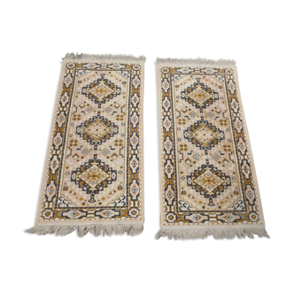 duo of small cotton rugs, oriental geometric decoration, with fringes