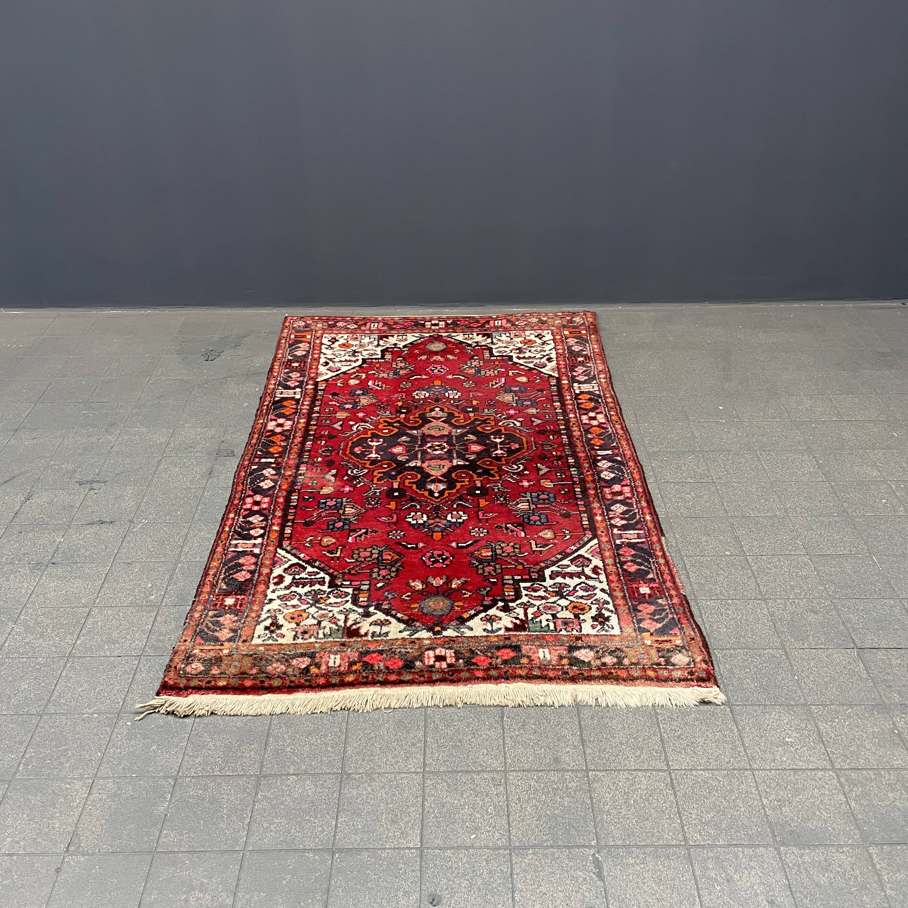 Worn vintage oriental rug or carpet