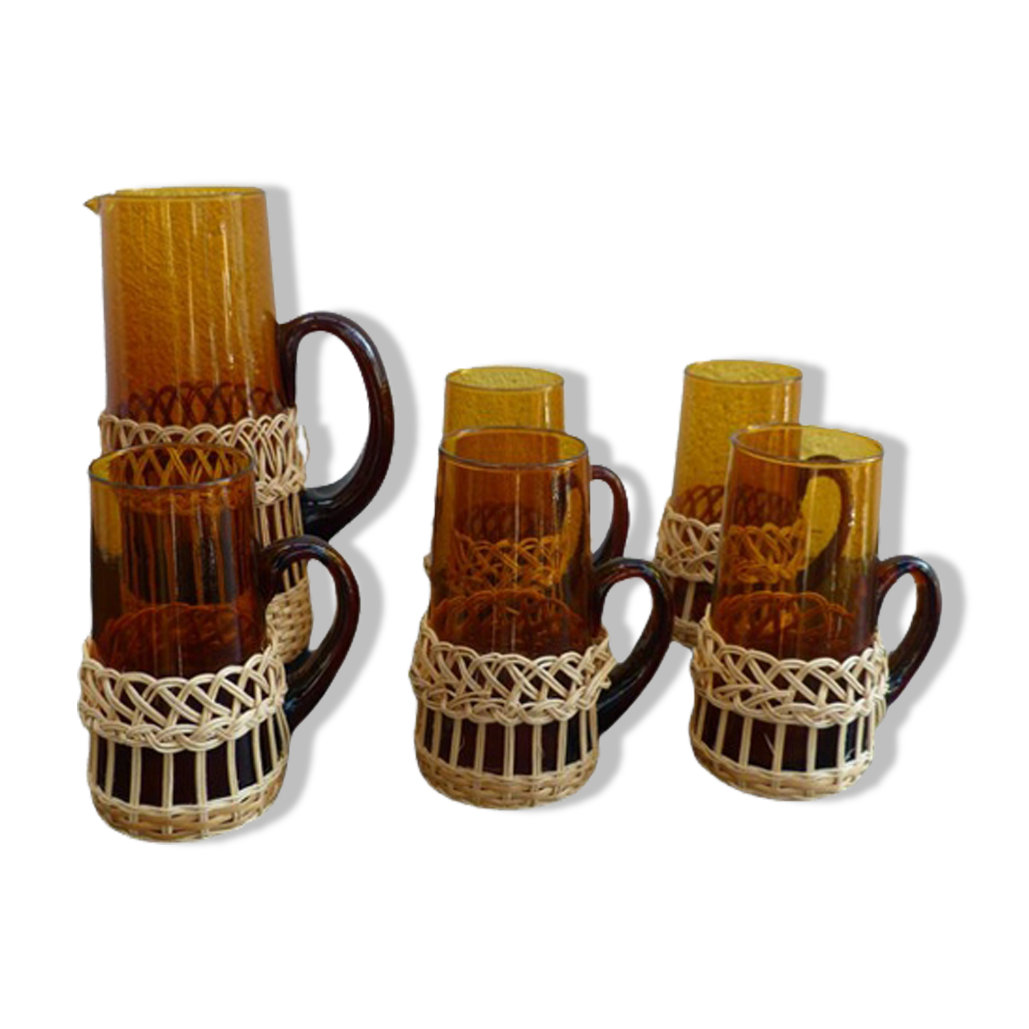 Fruit juice or vintage lemonade service in glass and wicker.