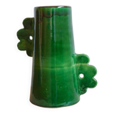 Handmade ceramic abstract vase with asymmetrical handles and fir green flowers