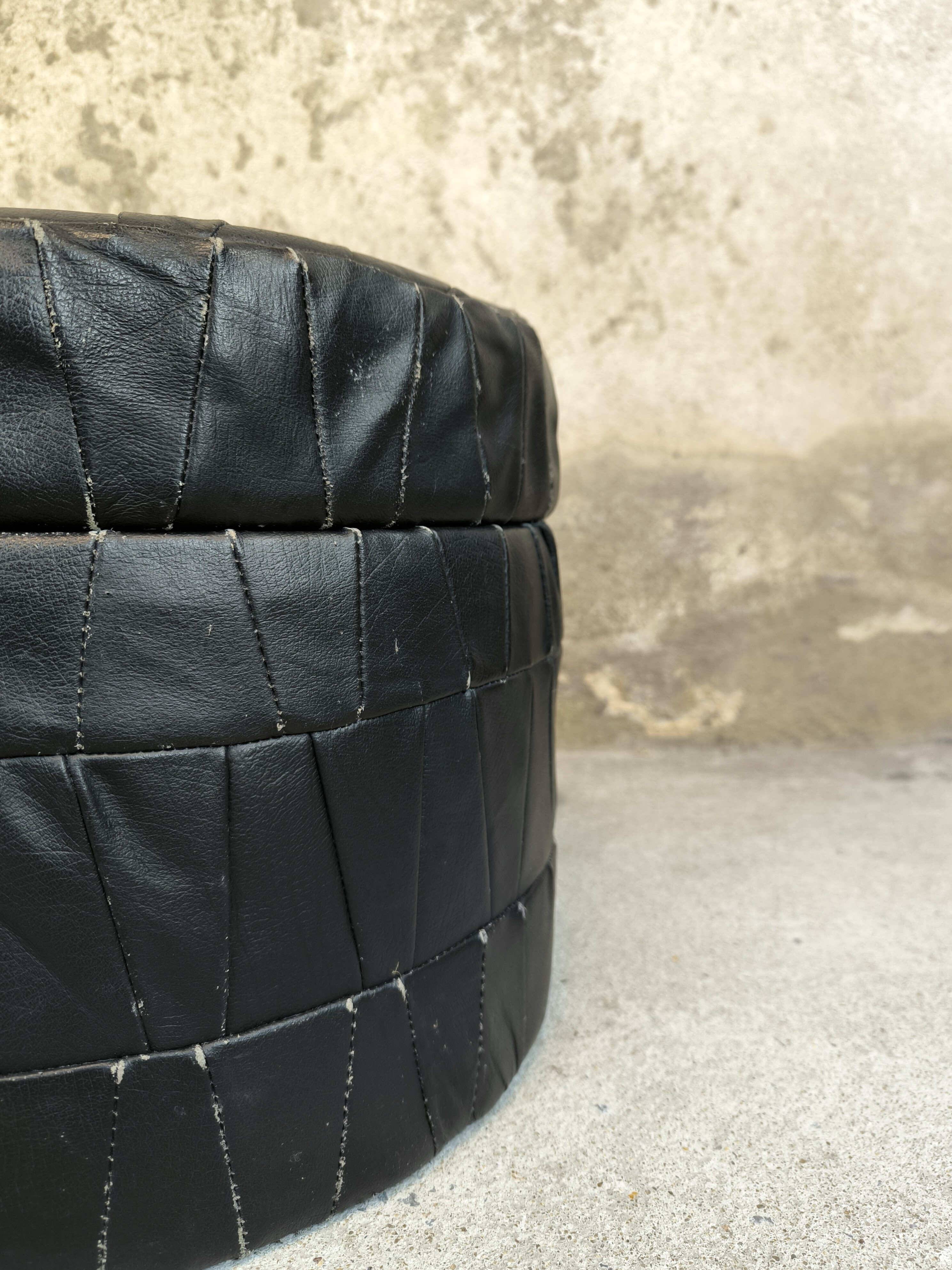 Vintage De Sede black leather storage pouf.