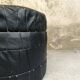 Vintage De Sede black leather storage pouf.