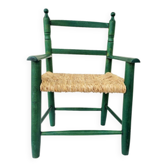 Small vintage children's chair in wood and green straw