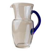 Vintage glass pitcher - clear glass with blue handle - Mid-Century design from Italy in the 1970s - elegant table decoration, retro gift idea.