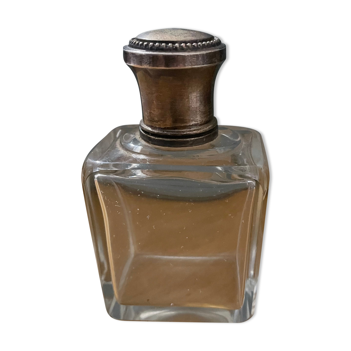 Old perfume bottle silver metal cap