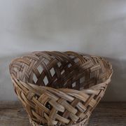 Vintage high round wicker basket with openwork.