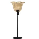 Table lamp with a lampshade with magnificent golden reflections