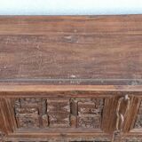 Old wooden console with chains
