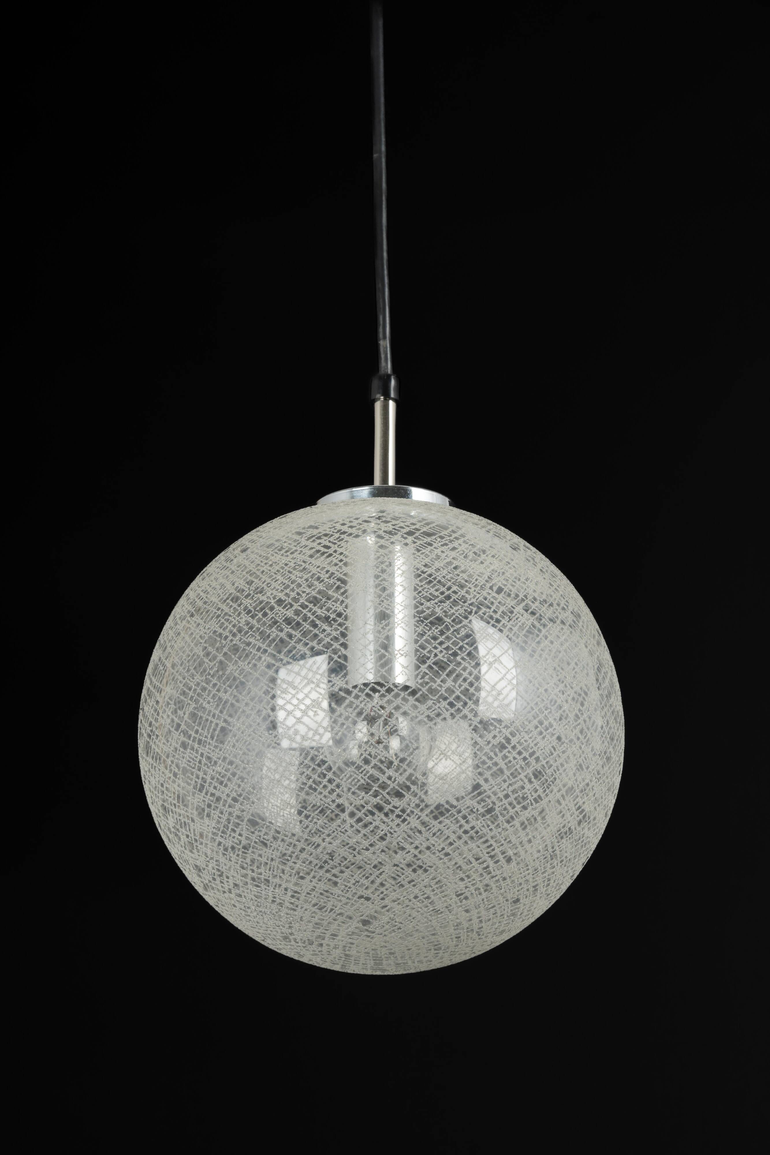 Small chrome Limburg pendant light with glass ball, Germany, 1970s.