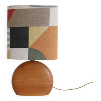 Small carved wooden floor lamp with oval shade