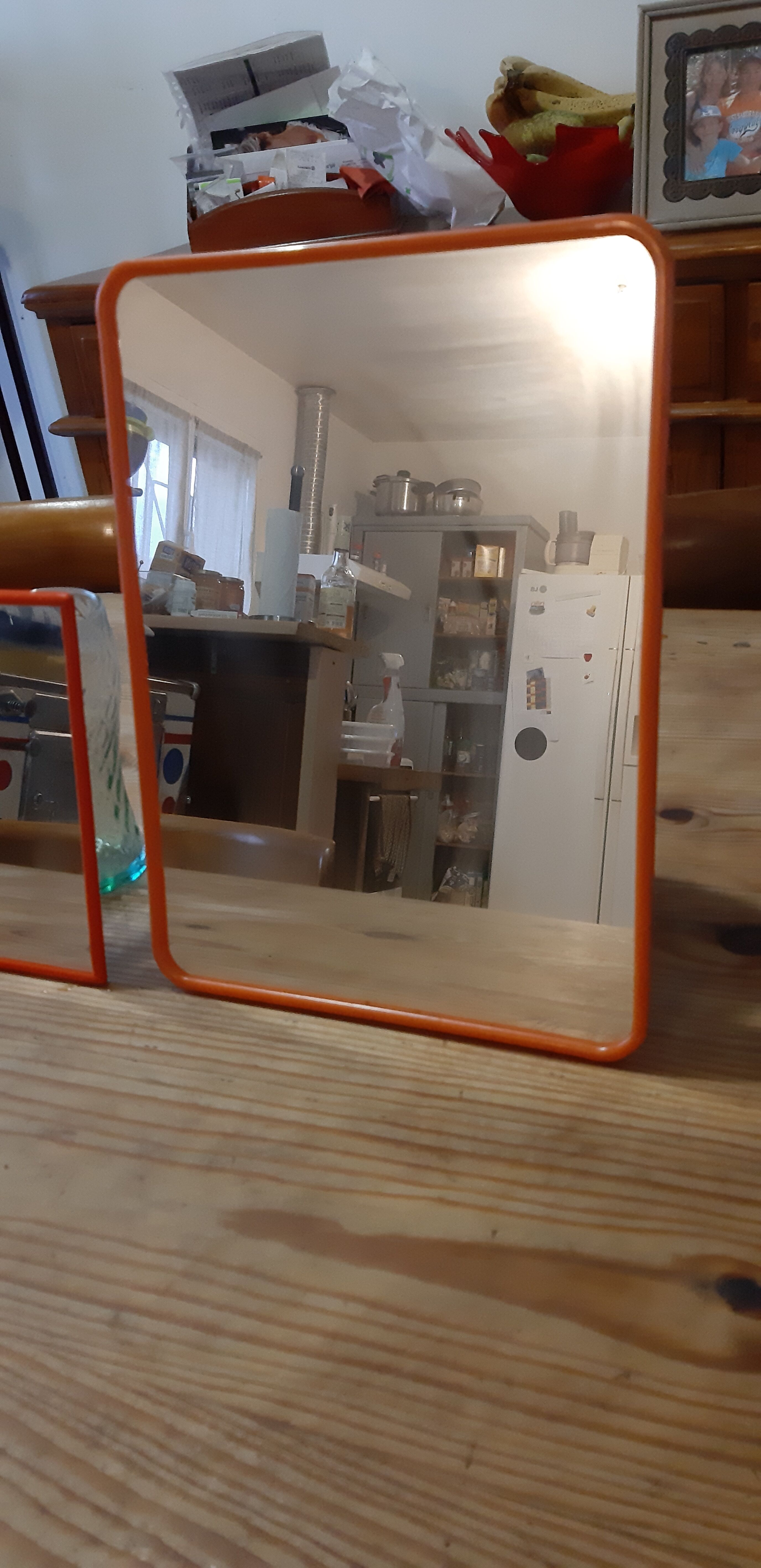 2 vintage plastic orange mirrors