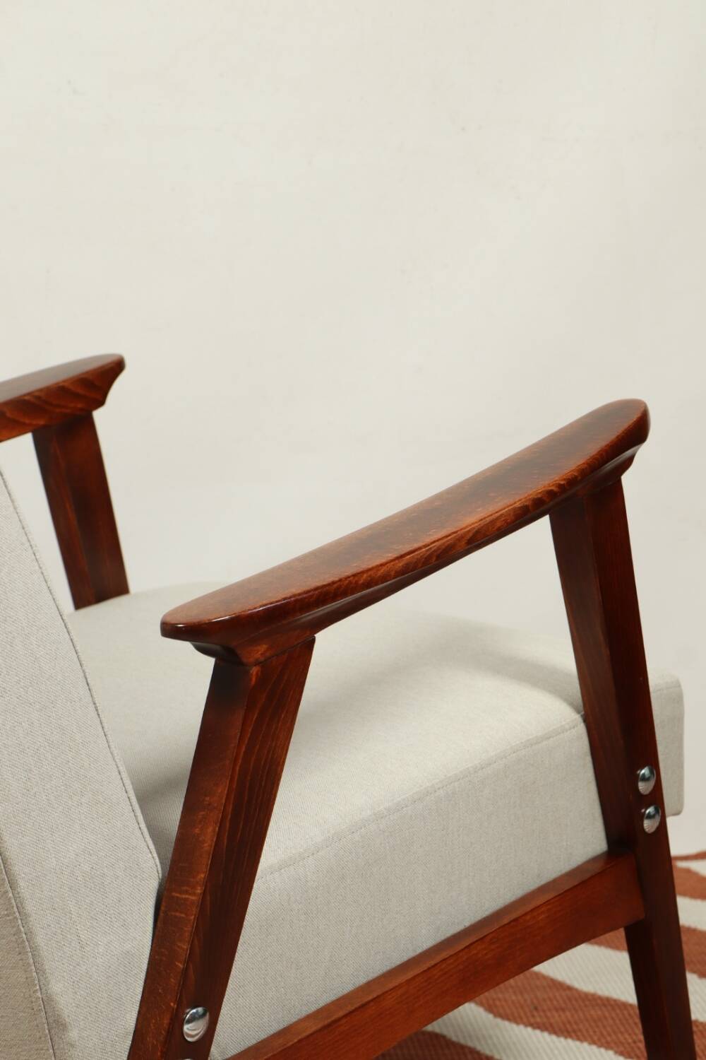 Vintage light gray armchair dark wood Scandinavian design 1970