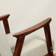 Vintage light gray armchair dark wood Scandinavian design 1970