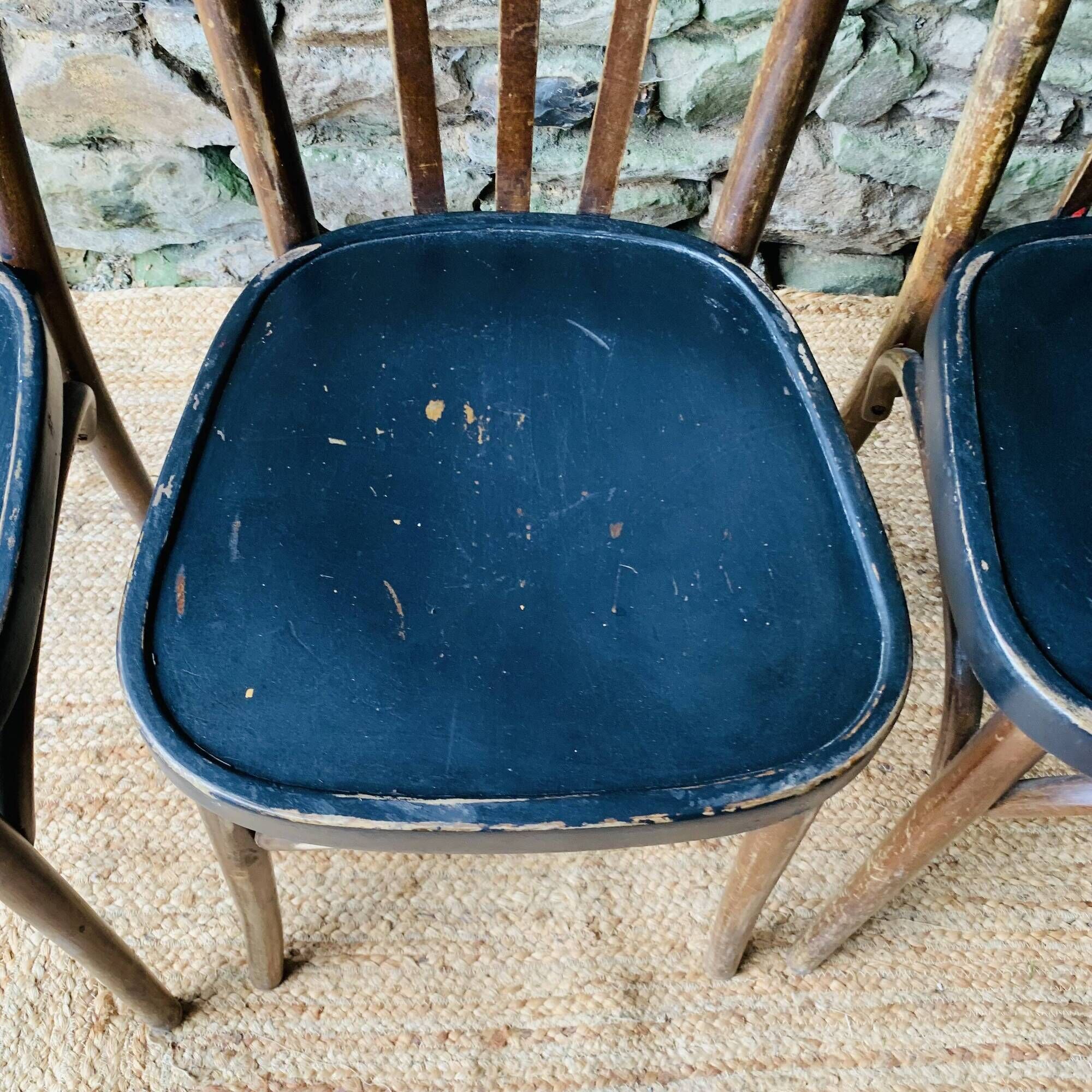 Set of four vintage bentwood bistro chairs.