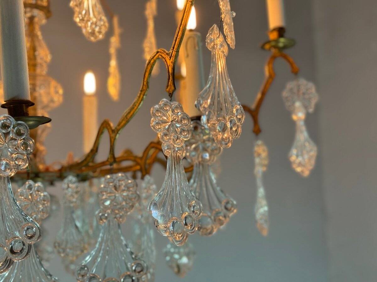 Gilt bronze cage chandelier decorated with glass pendants in the shape of peacock feathers circa 1800