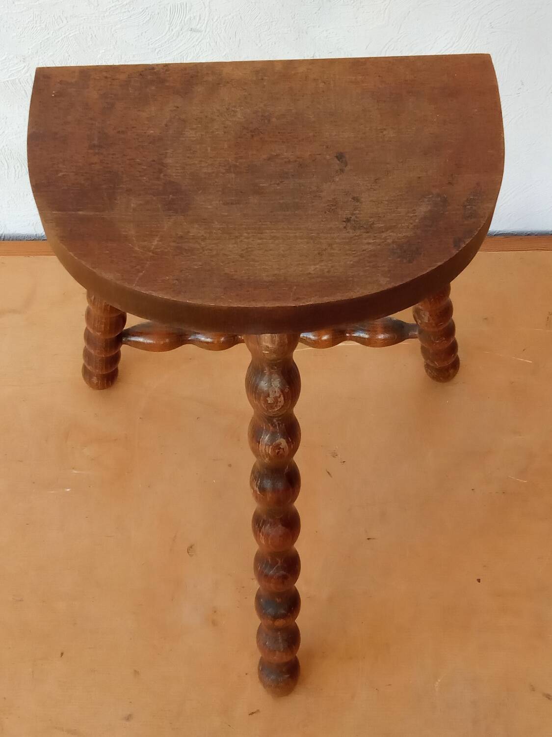 Beaded leg tripod stool